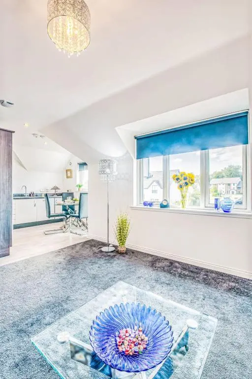 a living room with a glass table in the middle at Apartment Varis Haven by Interhome in Forres