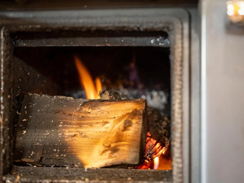 an open oven with a fire in it at Apartment Hazel Bothy by Interhome in Coldstone