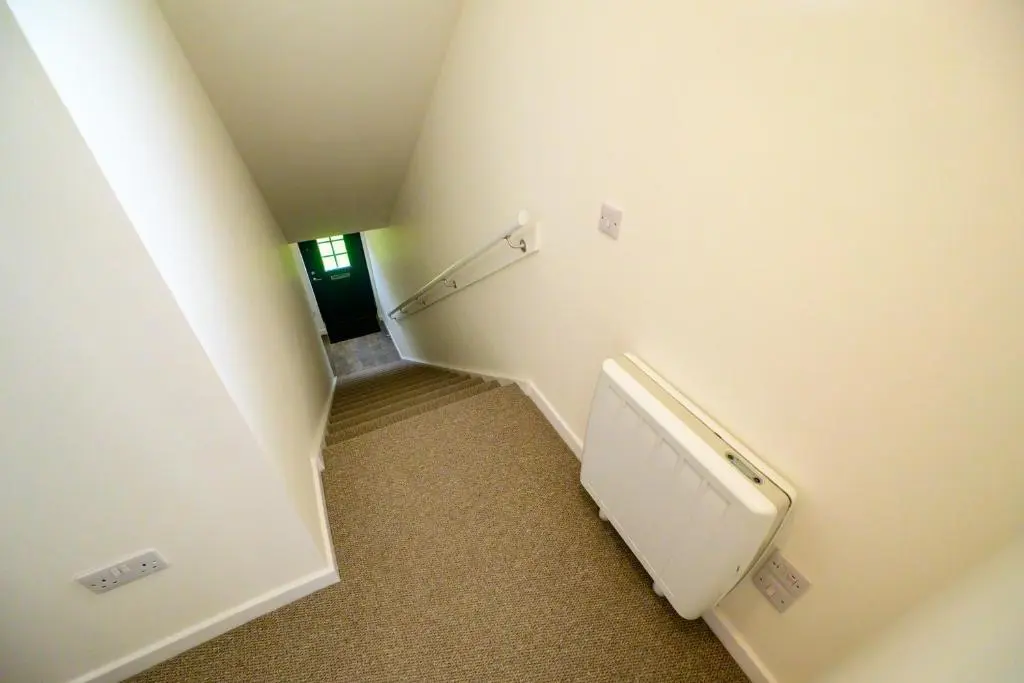 a bathroom with a urinal and a staircase with a stair case at 2 Bed Property, Beauly in Beauly