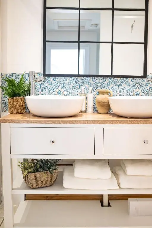 a bathroom with two sinks and a mirror at Lillymont Apartment - Inverness City Centre in Inverness