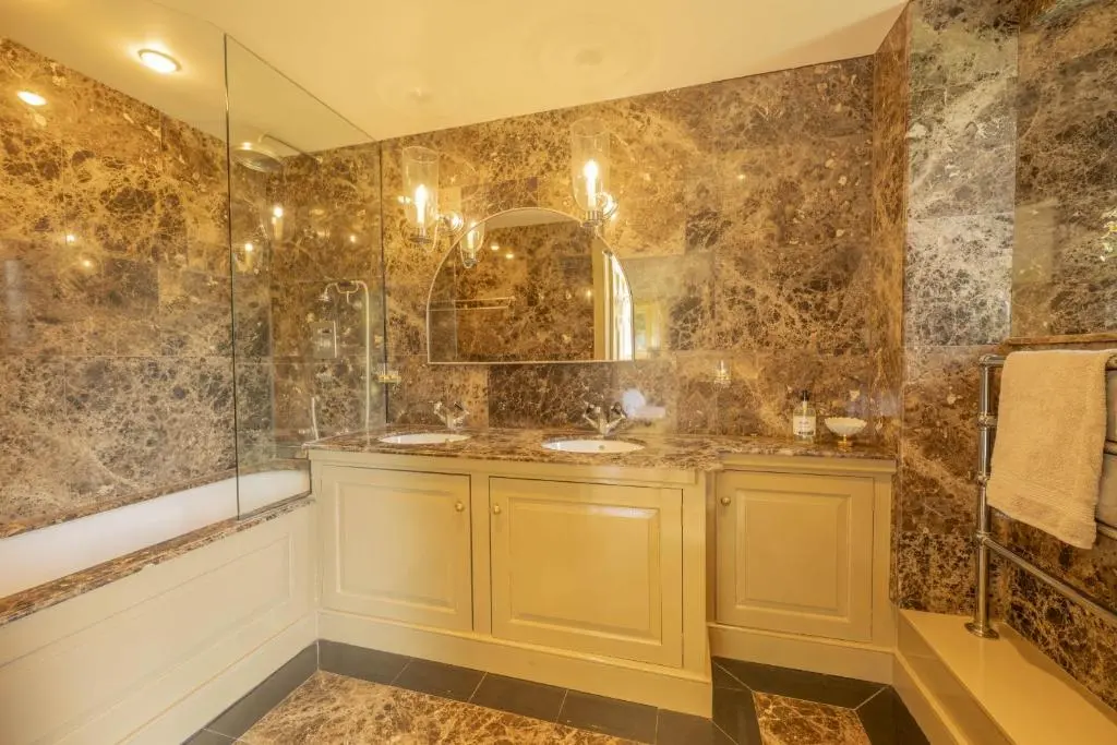 a bathroom with a sink and a shower at Drum Lodge in Nethy Bridge