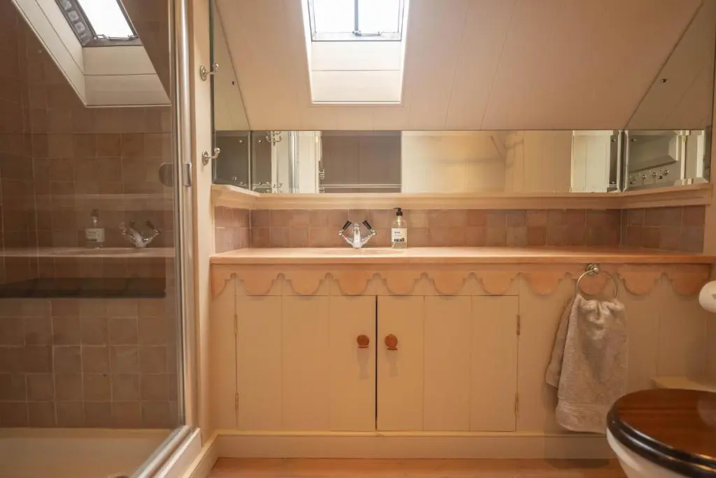 a bathroom with a shower and a sink at Drum Lodge in Nethy Bridge