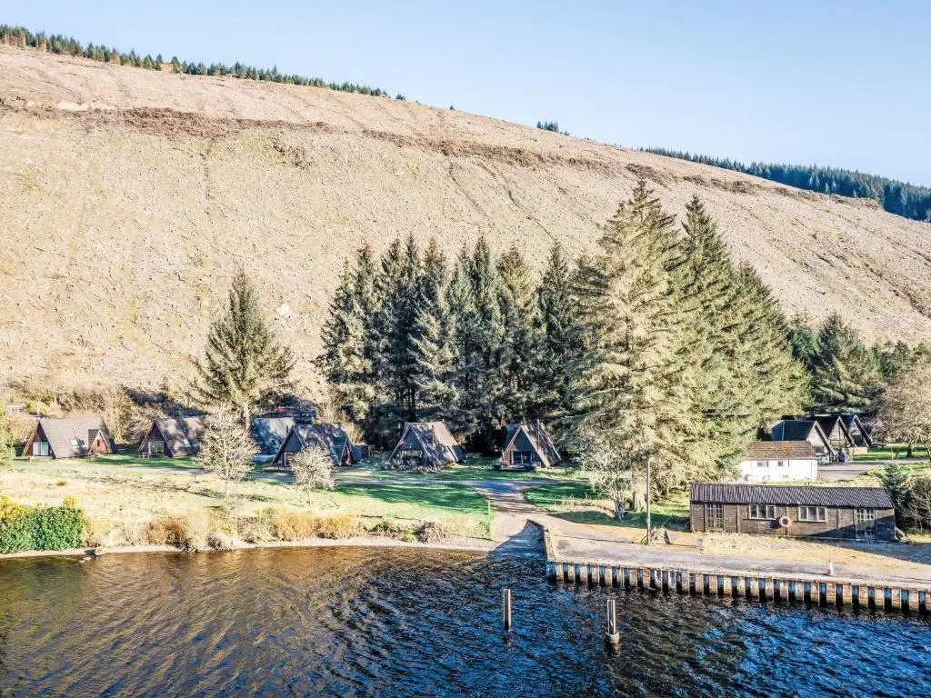a large body of water with houses and trees at Chalet Pine Needle Lodge by Interhome in Spean Bridge