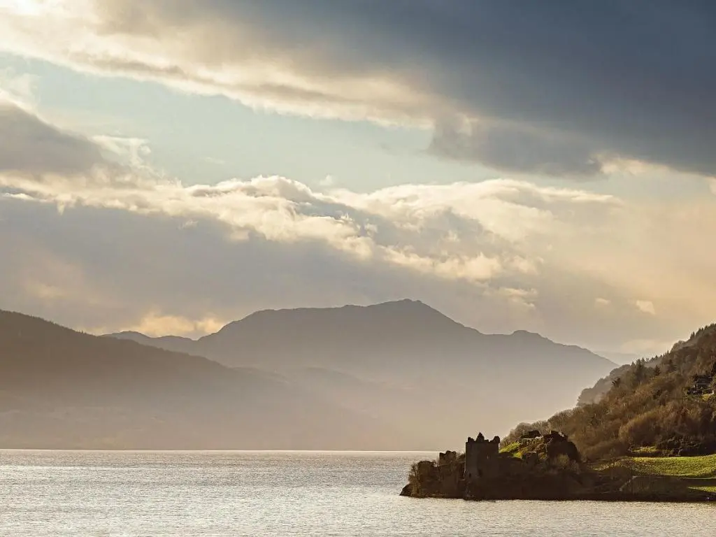 a castle in the middle of a body of water at Holiday Home Highland View by Interhome in Drumnadrochit