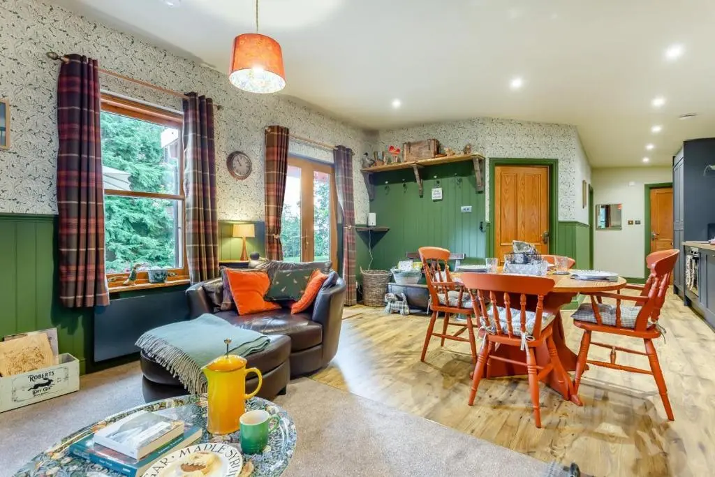 a living room with a couch and a table at 2 Bed in Invergordon oc-c33073 in Invergordon