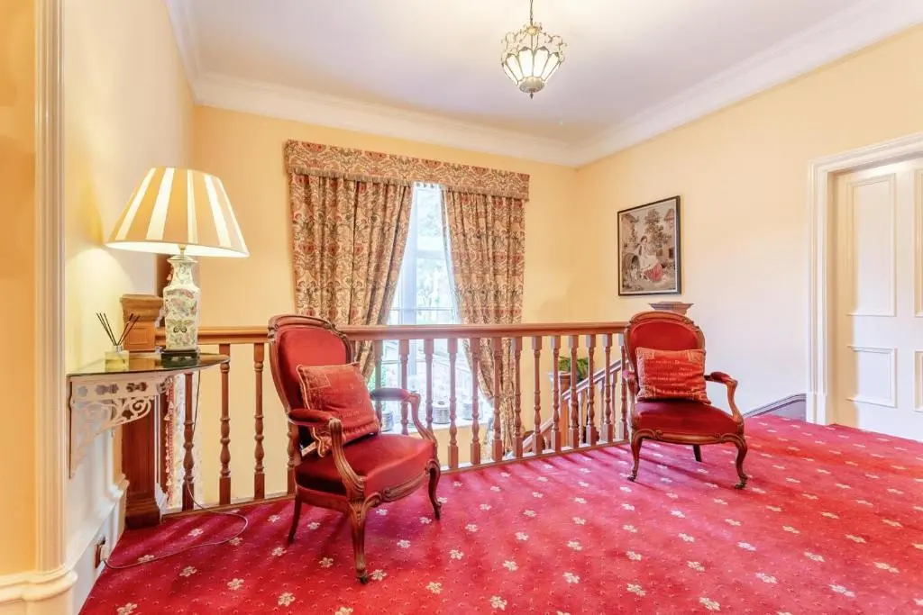 a room with two chairs and a balcony at 8 Bed in Invergordon oc-p32711 in Invergordon