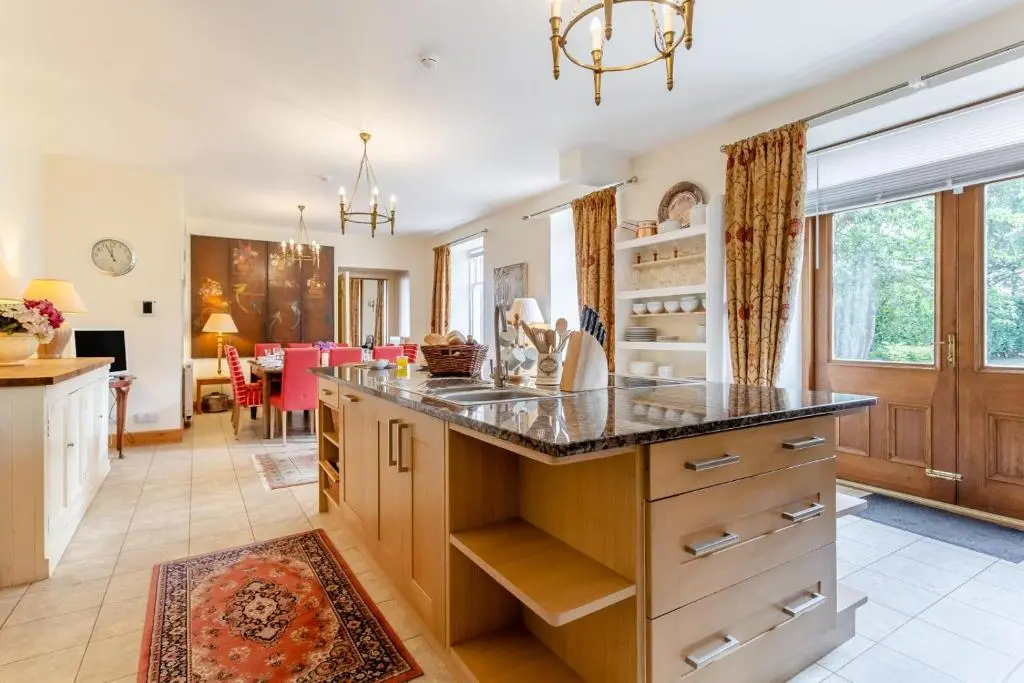 a kitchen with a large island with a counter top at 8 Bed in Invergordon oc-p32711 in Invergordon