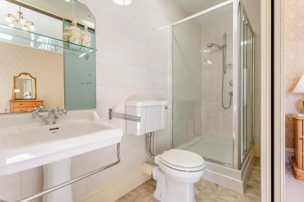 a bathroom with a sink and a toilet and a shower at 8 Bed in Invergordon oc-p32711 in Invergordon