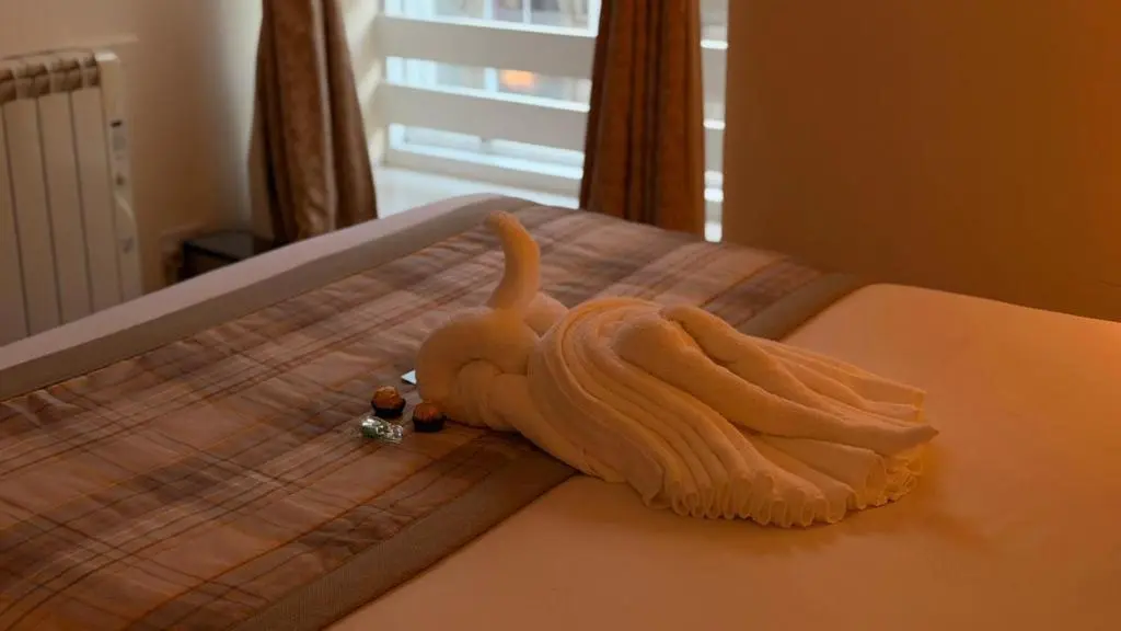 a toy elephant sitting on top of a bed at The Waverley Guest House in Inverness