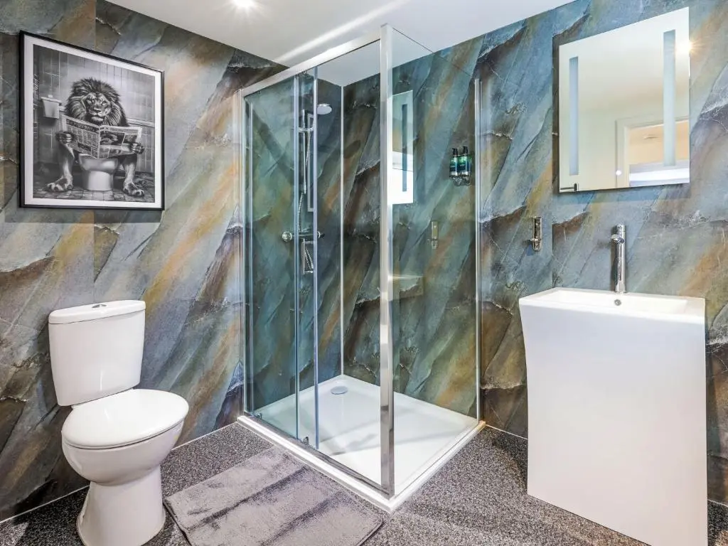 a bathroom with a shower and a toilet at Holiday Home Gordonstoun Cottage by Interhome in Elgin