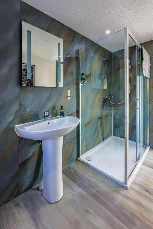 a bathroom with a sink and a shower at Duffus Nights in Duffus