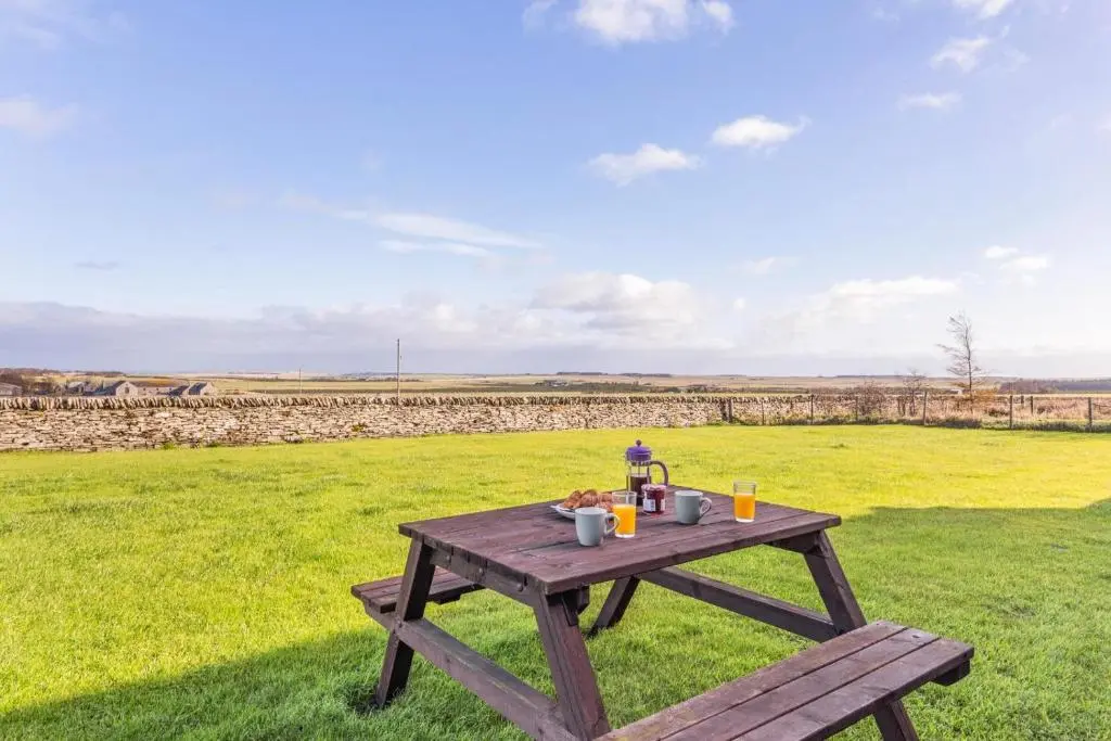a picnic table in the middle of a field at 1 Bed in Wick oc-b33442 in Wick