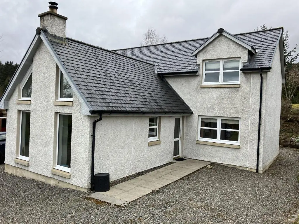 a white house with a lot of windows at Oiseval in Fort Augustus