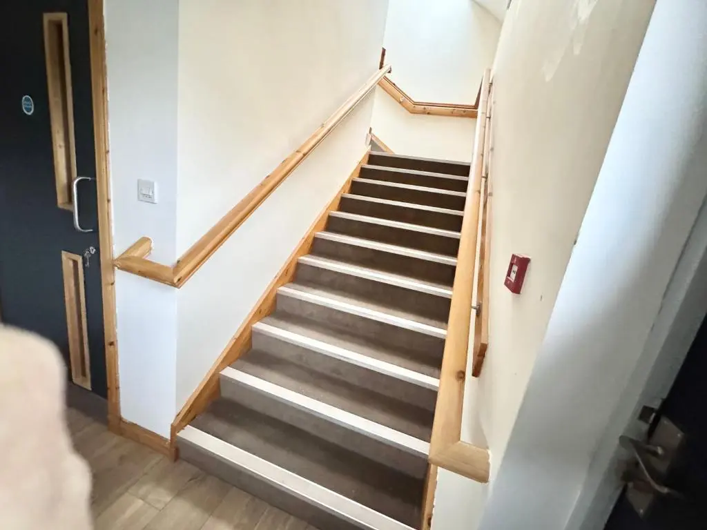 a staircase in a house with a stair case at Suites Holiday Home Inverness in Inverness