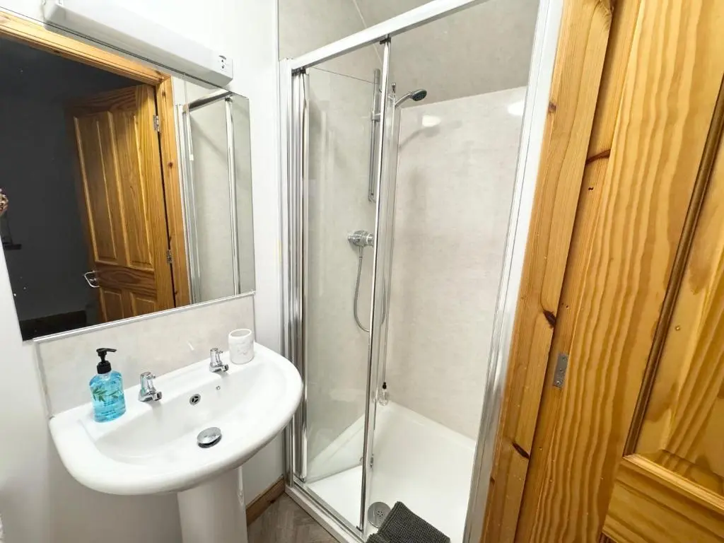 a bathroom with a sink and a shower at Suites Holiday Home Inverness in Inverness