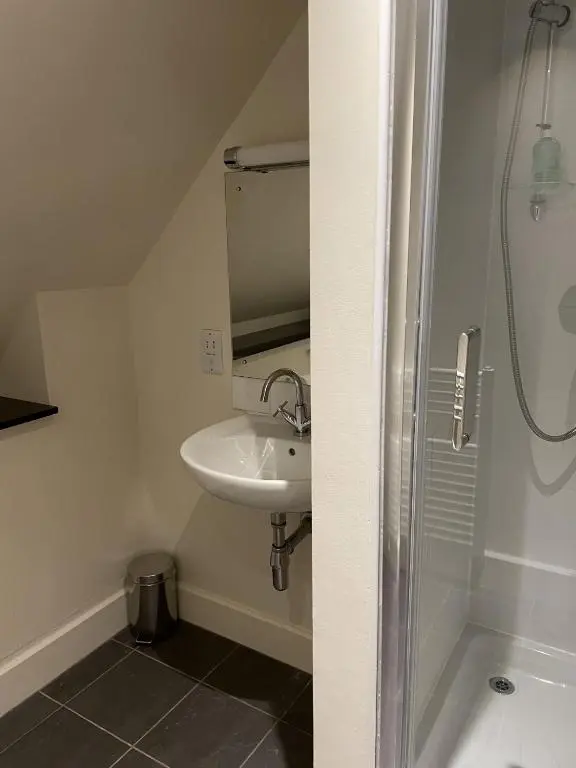 a bathroom with a sink and a shower at Moat House 6 in Fort Augustus