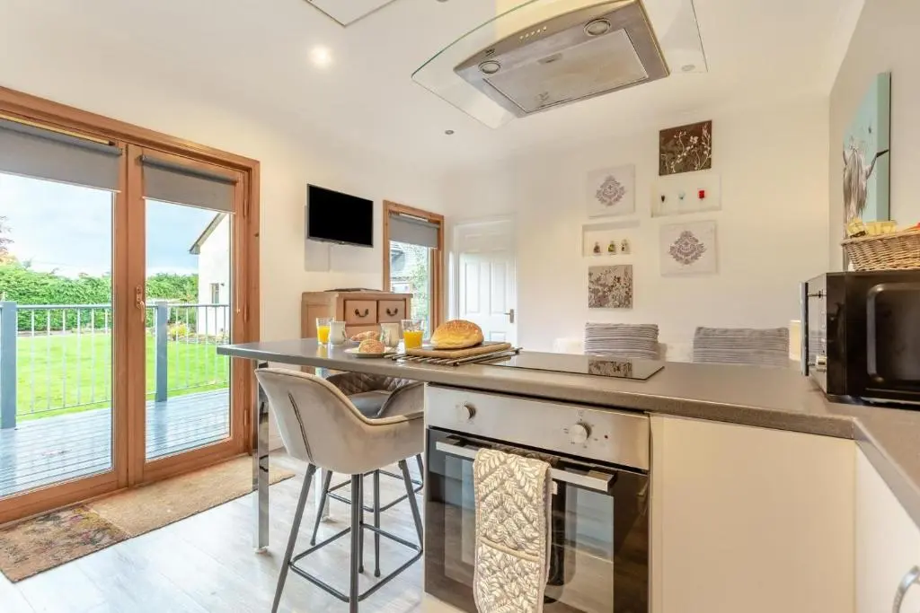 a kitchen with a counter and a stove top oven at 1 Bed in Inverness oc-a33726 in Inverness