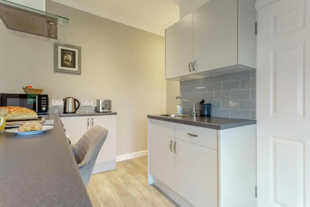 a kitchen with white cabinets and a counter top at 1 Bed in Inverness oc-a33726 in Inverness
