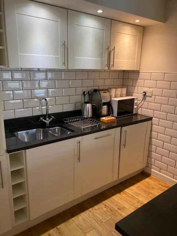 a kitchen with a sink and a counter top at Raven Wing 17 - Aonach Mor in Fort Augustus
