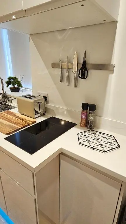 a kitchen with a sink and a counter top at Inverness City Centre Studio Flat in Inverness