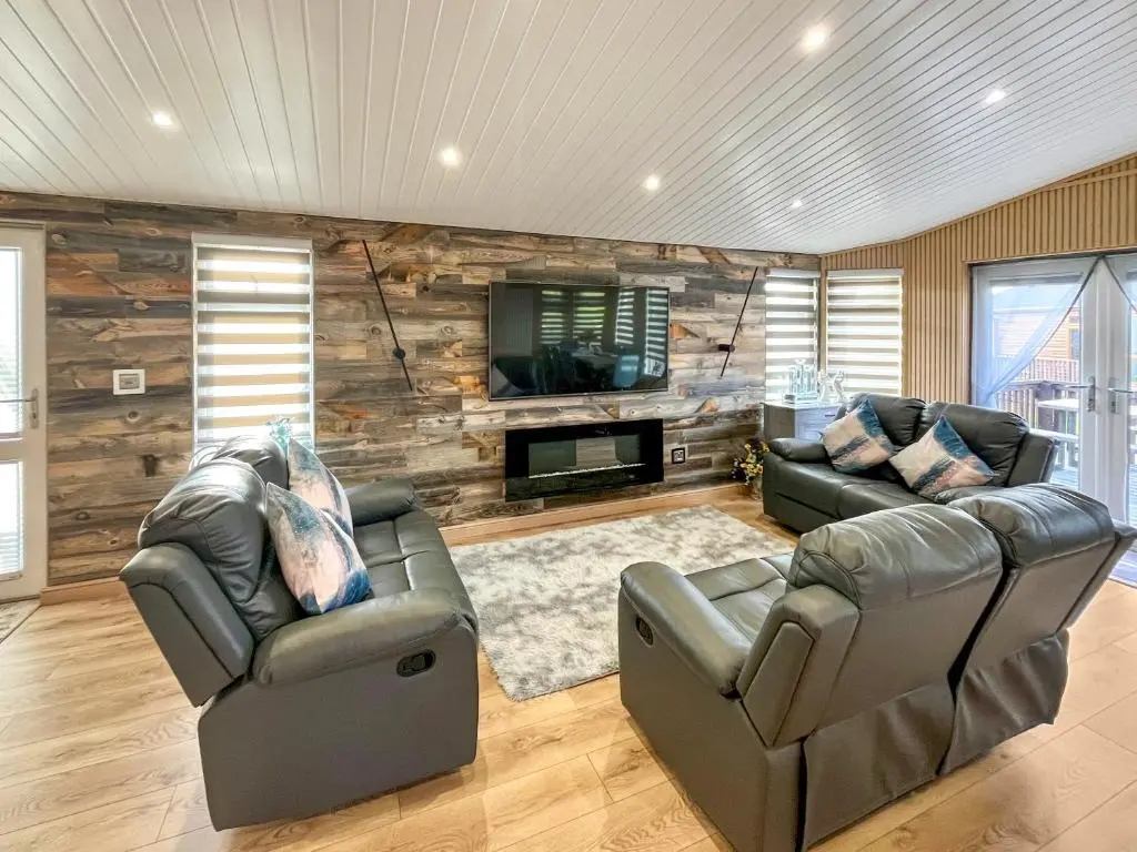 a living room with two couches and a tv at Haven Lodge - Uk50792 in Banchory