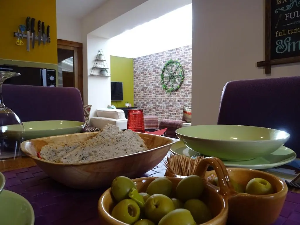 a table with bowls of food on top of it at 'Le Studio' in Inverness