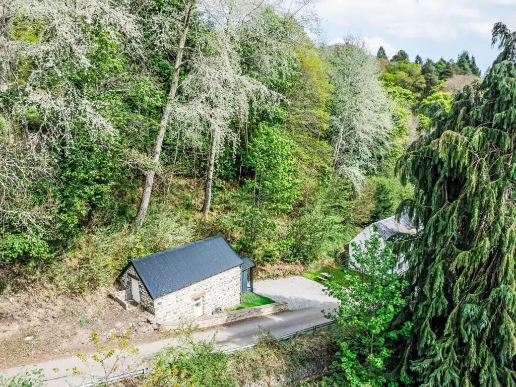an overhead view of a building in a forest at Holiday Home Wayside Bothy by Interhome in Drumnadrochit