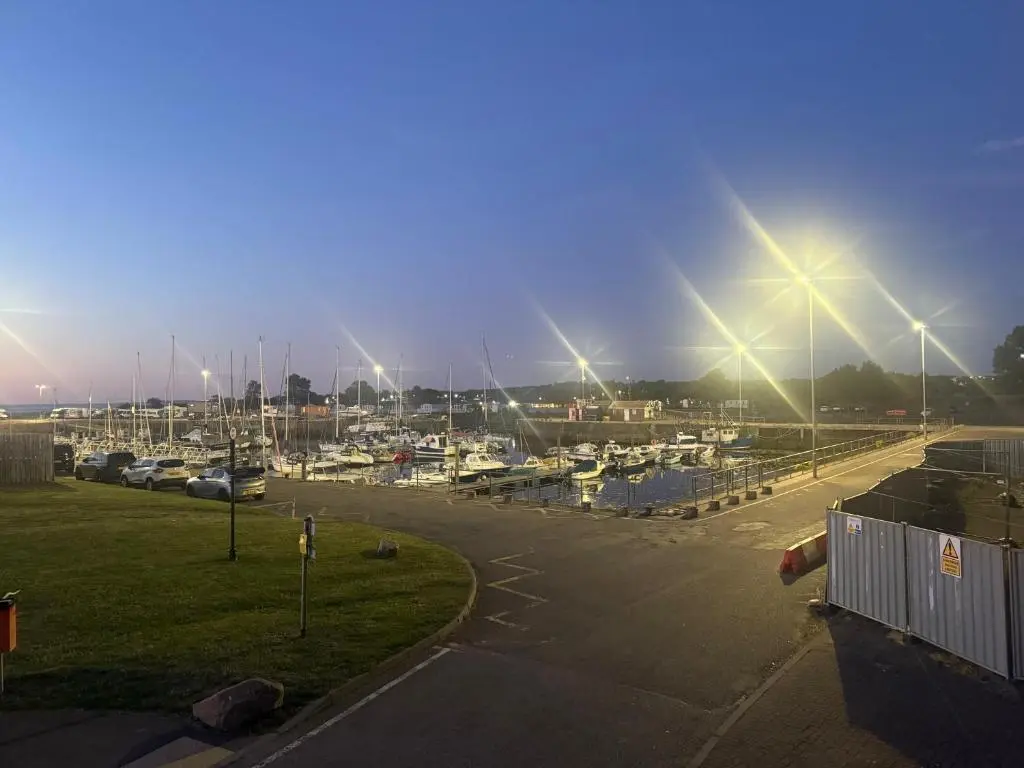 a parking lot with a marina with boats in it at Firth Tides in Nairn