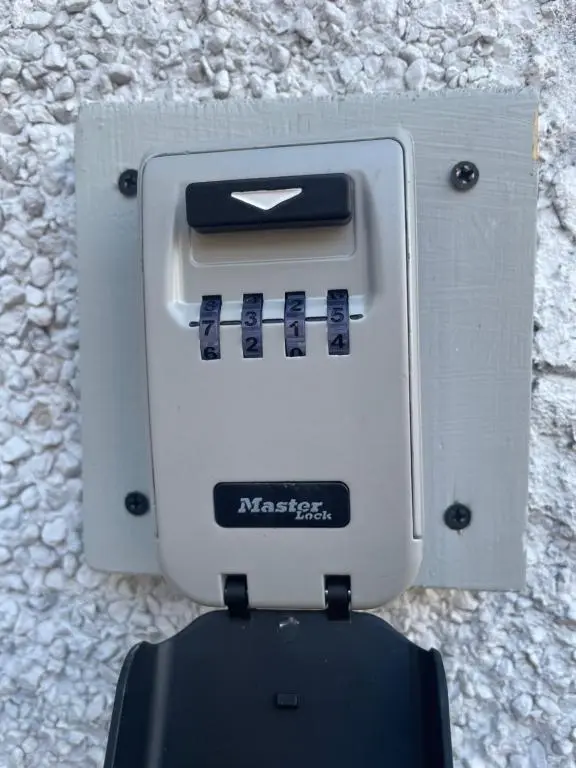 a gray and black machine sitting on a wall at Garden Room at Tartan House in Inverness