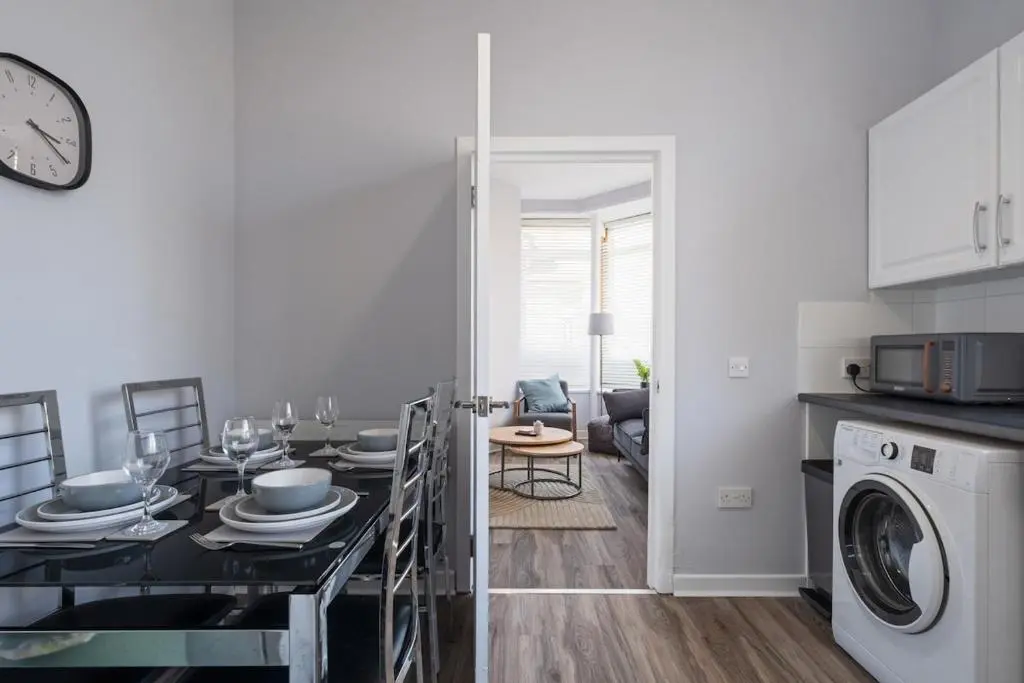a kitchen and dining room with a table and a dining roomiasm at Charming 2 bed in Aberchirder in Aberchirder