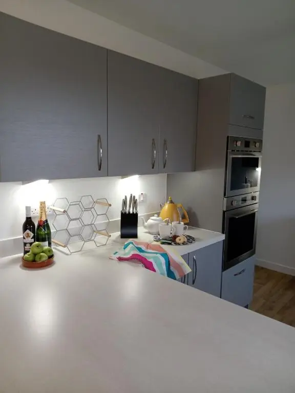 a kitchen with a white counter top in a room at Modern 4 Bed Highland Home in Culloden