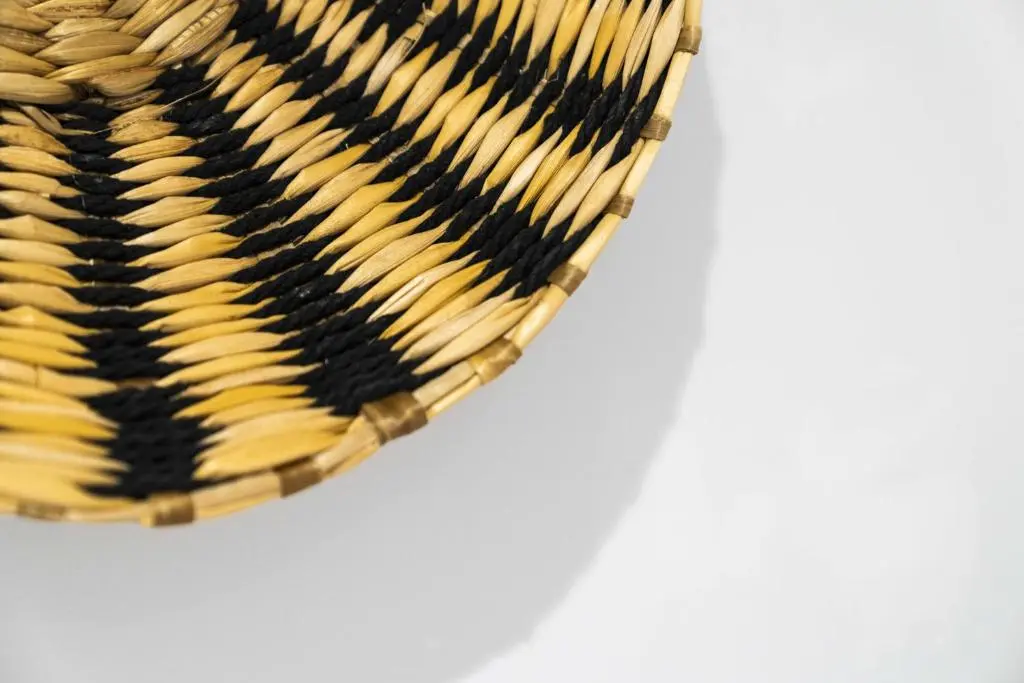 a woven basket with black and yellow yarn at Temple 1 Bedroom Studio - Inverness in Inverness