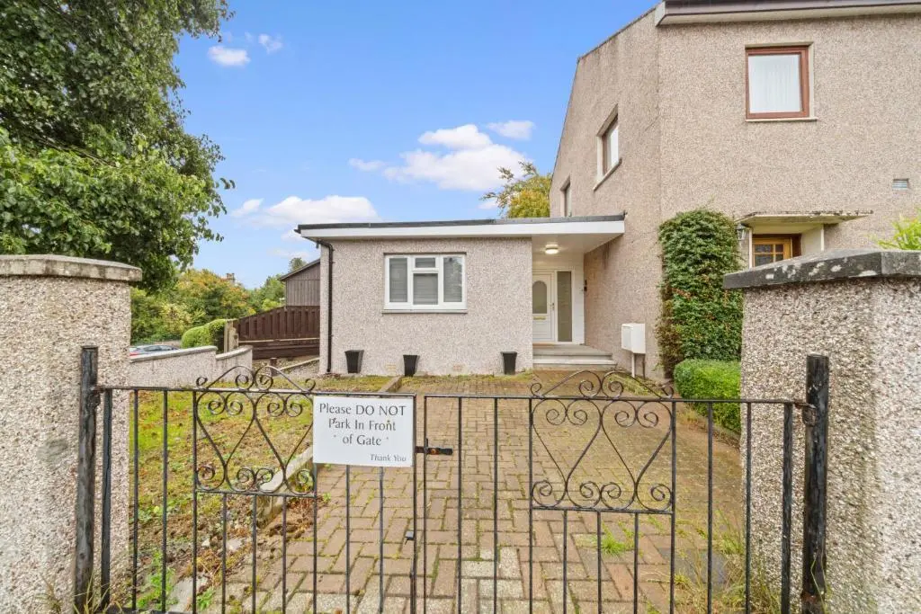 a house with a gate with a sign on it at Temple 1 Bedroom Studio - Inverness in Inverness