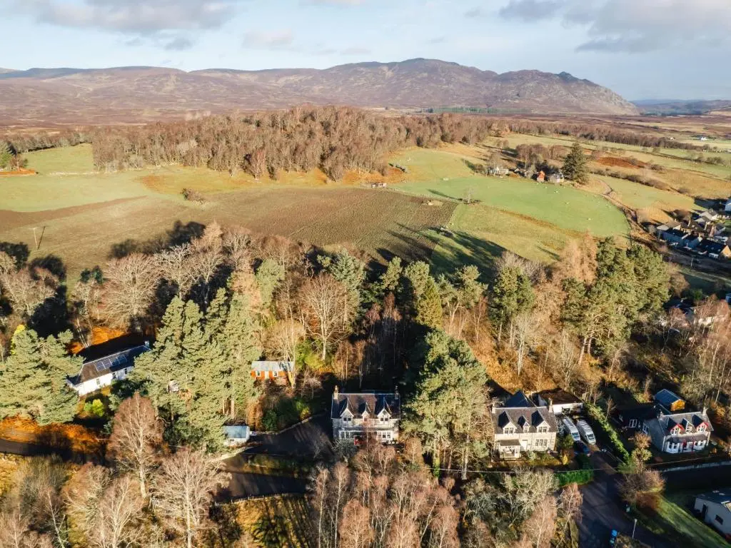 an aerial view of a house on a hill with trees at Villa Netherwood by Interhome in Newtonmore