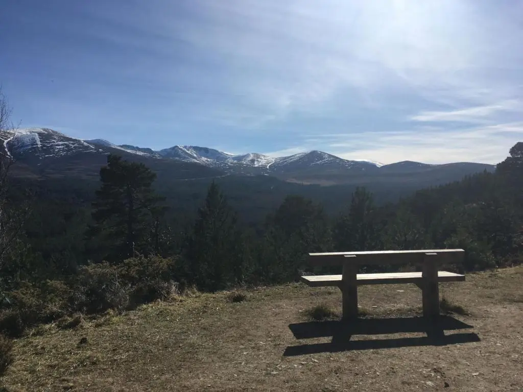 a bench sitting on top of a hill with mountains at Holiday Home Greenaway by Interhome in Skye of Curr