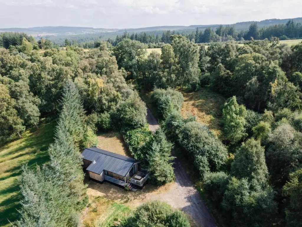 an aerial view of a barn in the middle of a forest at Chalet The Cabin by Interhome in Eskadale