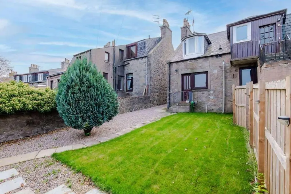 an exterior view of a house with a yard at Airport apartment - Aberdeen - Free Parking in Aberdeen
