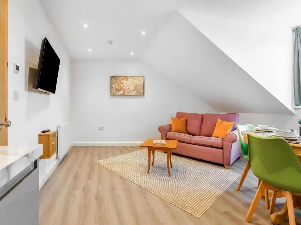 a living room with a couch and a table at Family - Central - Parking - Wifi - Sleeps 3 in Inverness