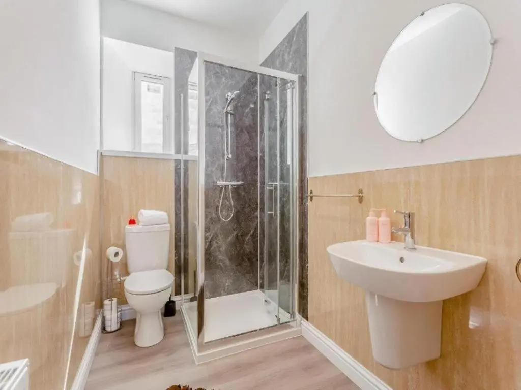 a bathroom with a shower and a sink and a toilet at Family - Central - Parking - Wifi - Sleeps 4 in Inverness