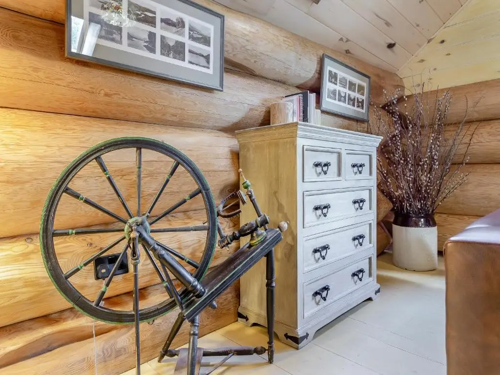 a wooden room with aokedoked wheel and a dresser at Sylvia - Uk50065 in Struy