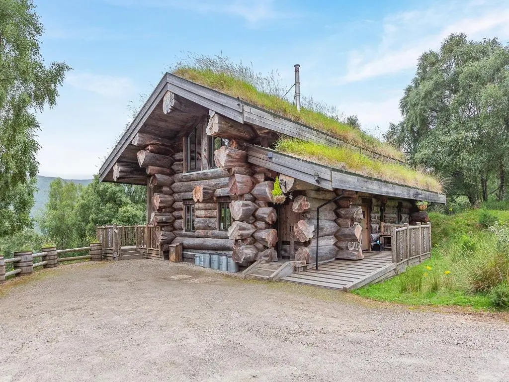 a log cabin with a grass roof at Cinclus - Uk50066 in Struy