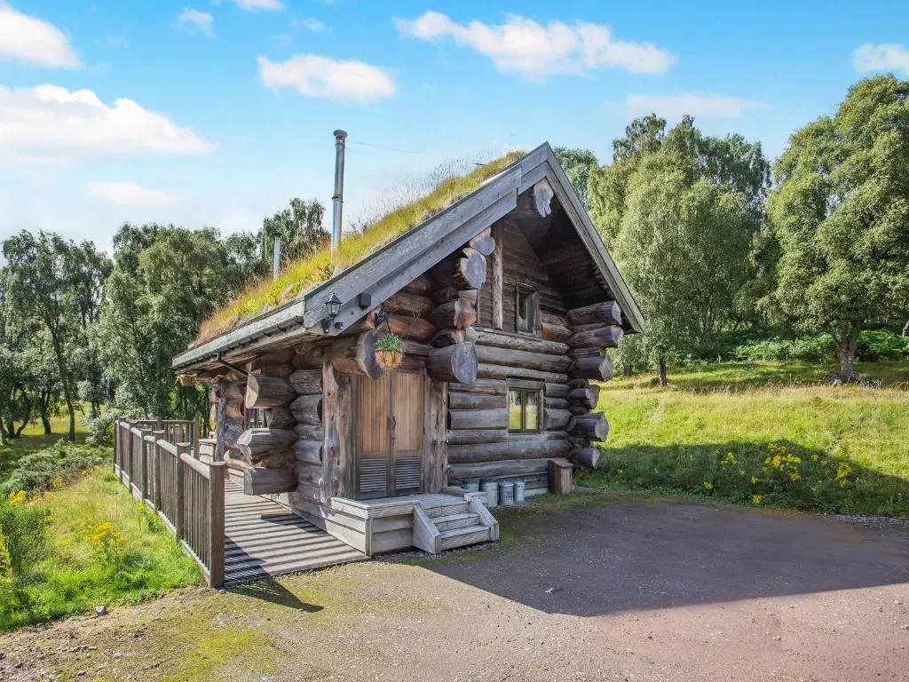 a log cabin with a grass roof at Parus - Uk50083 in Beauly