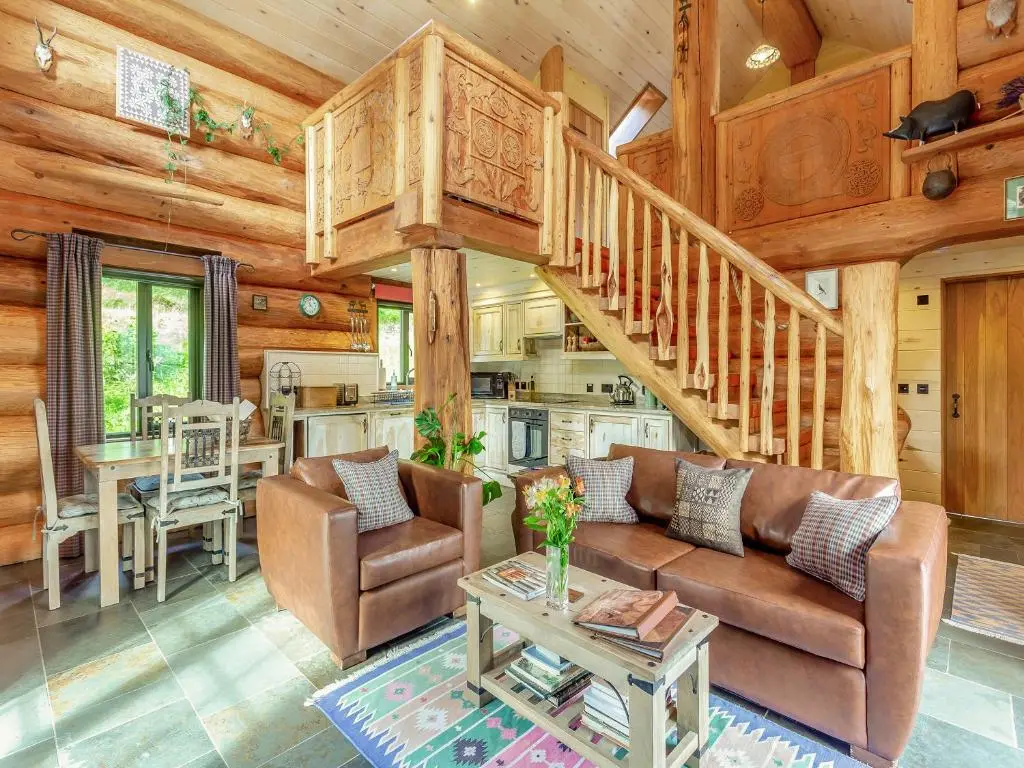 a living room with a couch and a staircase at Parus - Uk50083 in Beauly