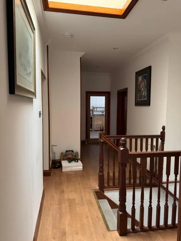 a hallway with a staircase in a house at TSB Accommodation in Turriff