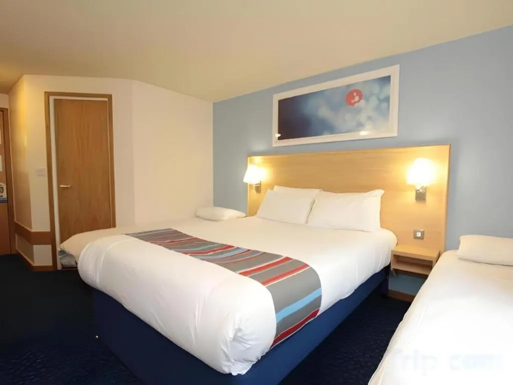 a hotel room with two beds at Travelodge Inverness Fairways in Inshes