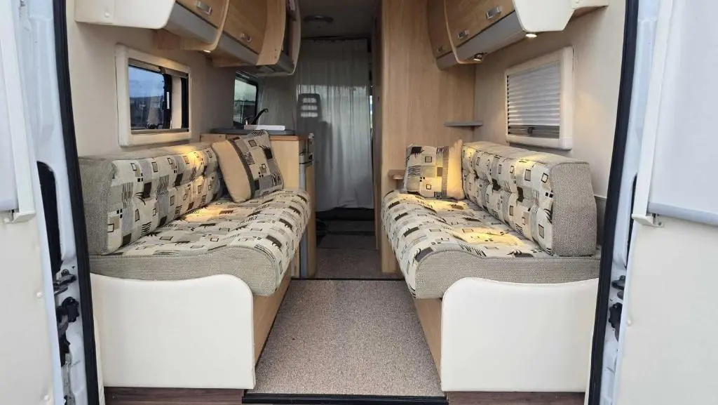 a room with three beds in an rv at Rover Rentals in Inverness