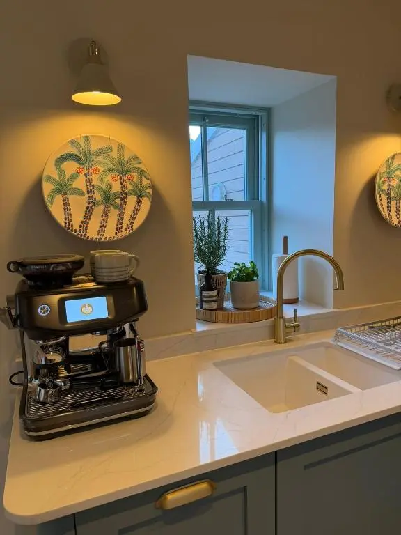 a kitchen with a coffee maker on a counter at Gilchrist Square in Dornoch