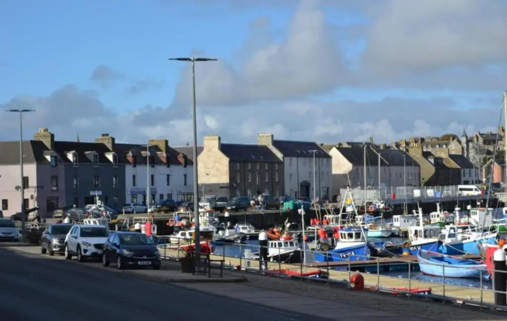 a group of boats parked in a harbor at 14 Harbour View in Wick