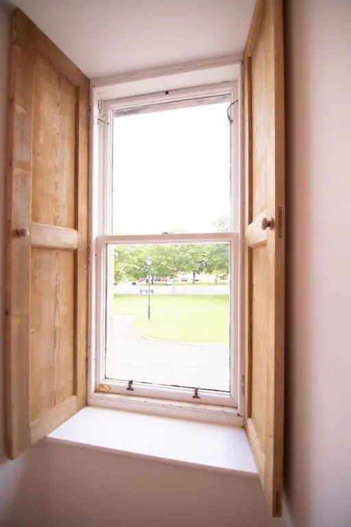 an open window with a view of a field at Calder House, Fochabers in Fochabers