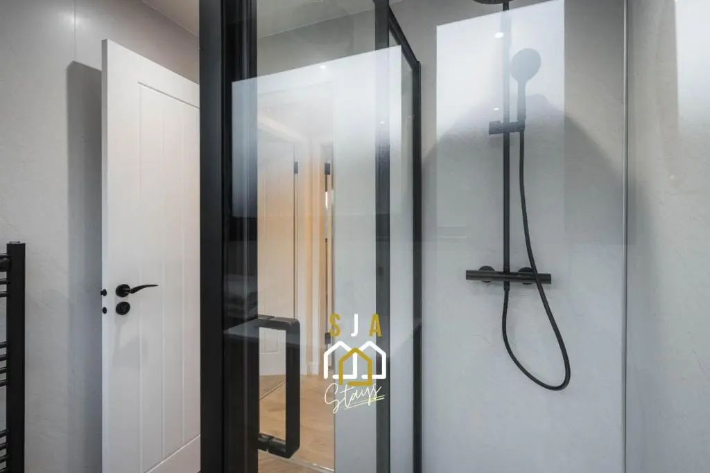 a shower in a bathroom with a glass door at Fraserburgh Stay - SJA Stays - Modern 2 Bed Apartment in Fraserburgh